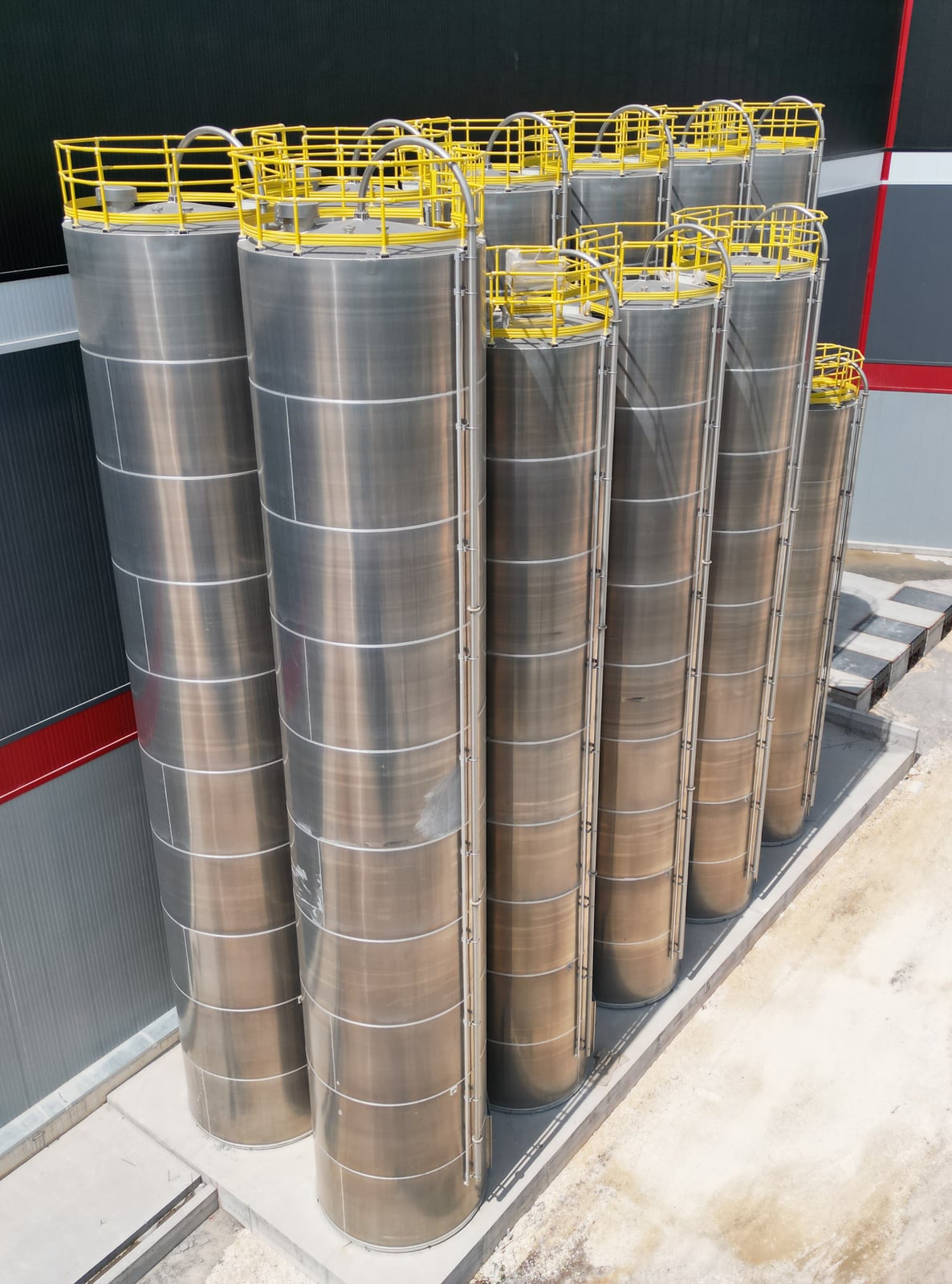 Aerial view of the 11+4 aluminium silo group built for the central raw-material system