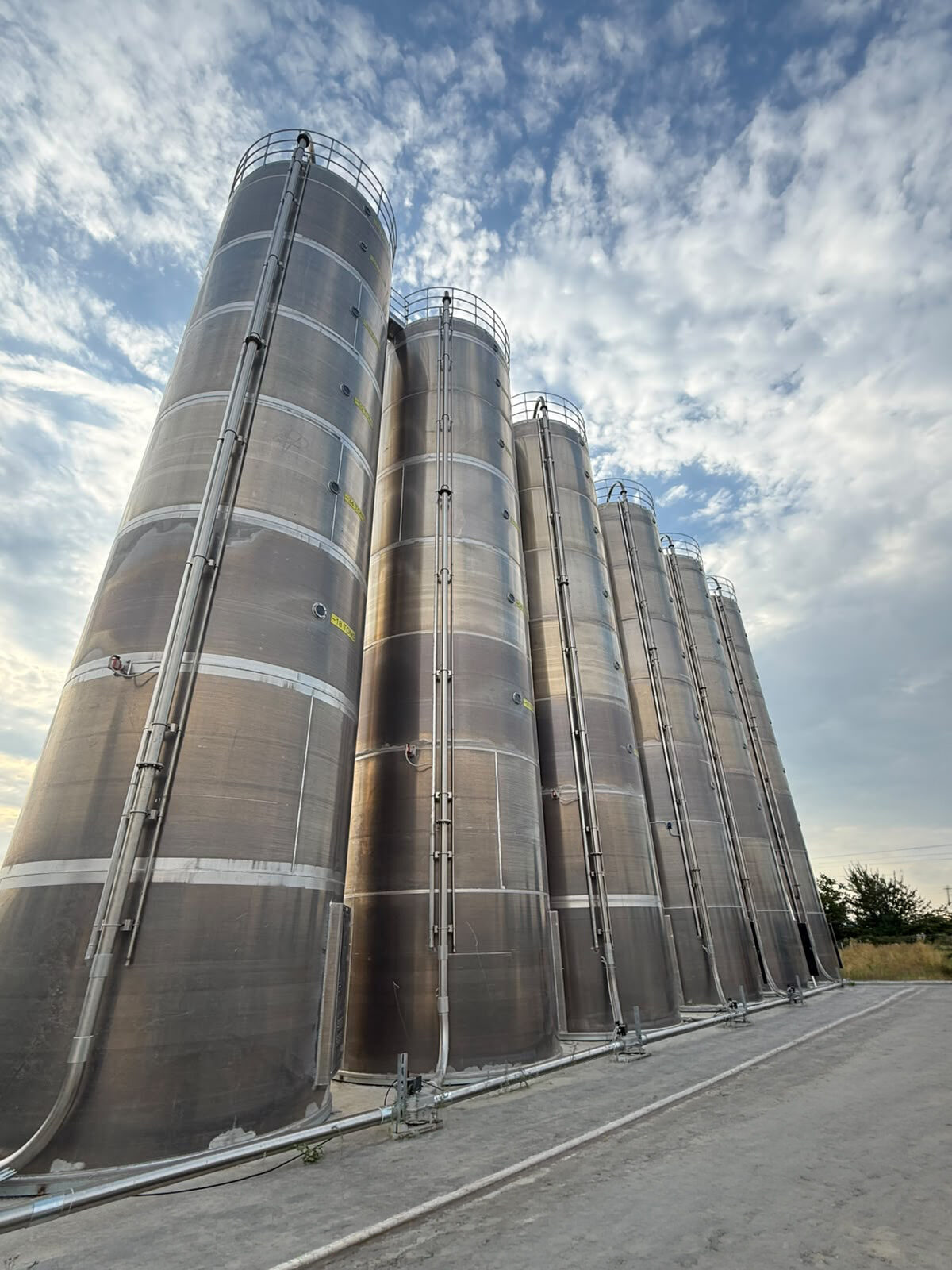 The giant vertical raw-material silos seen from below